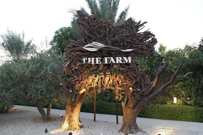 The Farm Restaurant entrance with artistic tree sculpture, Al Barari, Dubai.