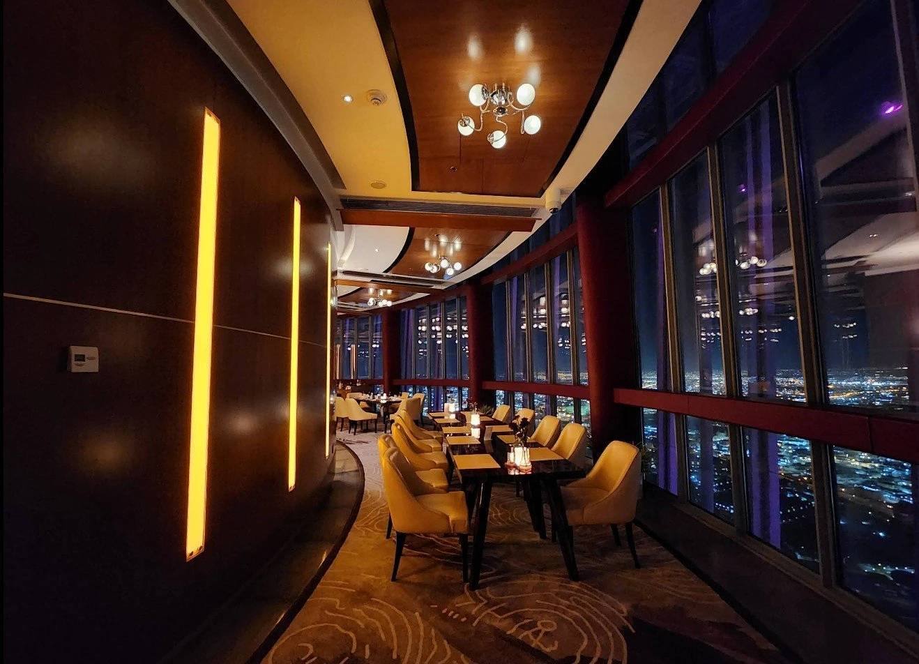 Elegant dining area at Three Sixty Restaurant 360 Doha, city view.