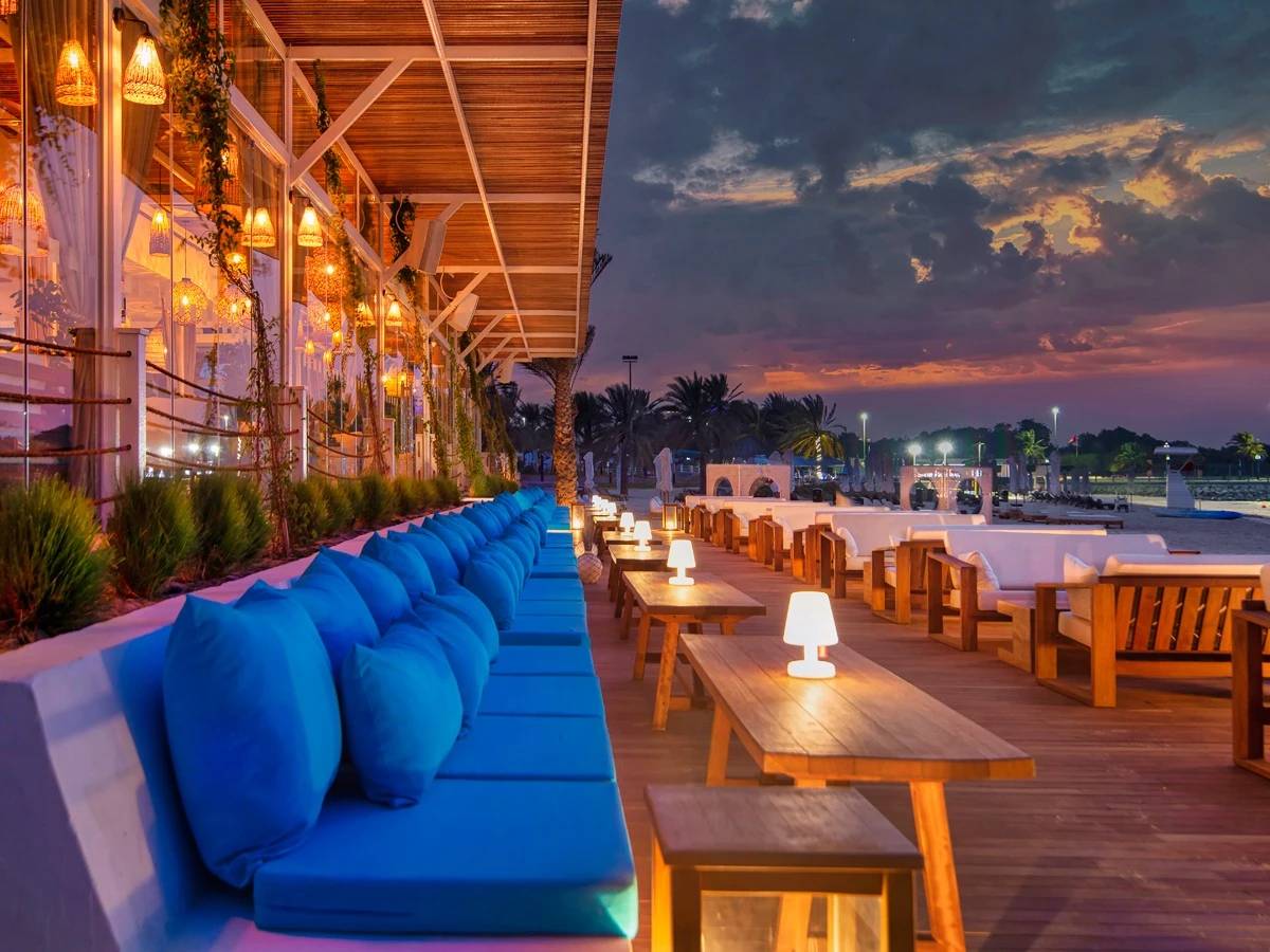 Sunset view at West Bay Lounge, Abu Dhabi beachfront seating area.