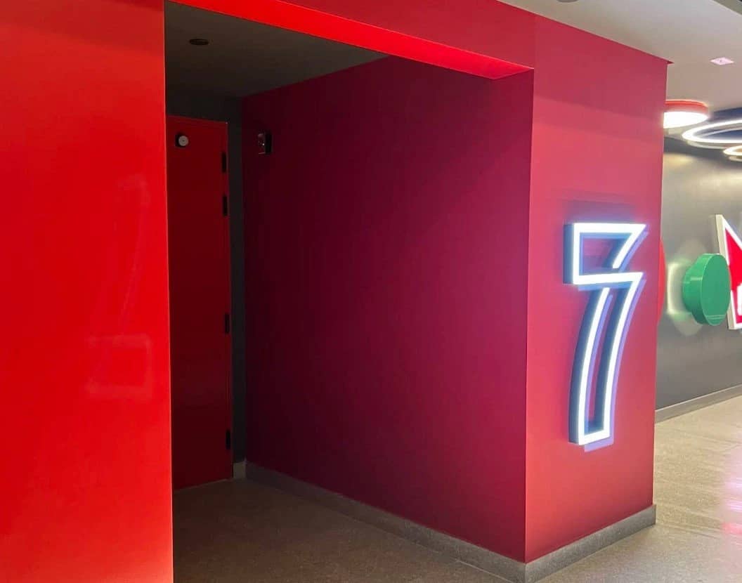 Red hallway with neon number seven, Empire Cinema Al Hofuf.
