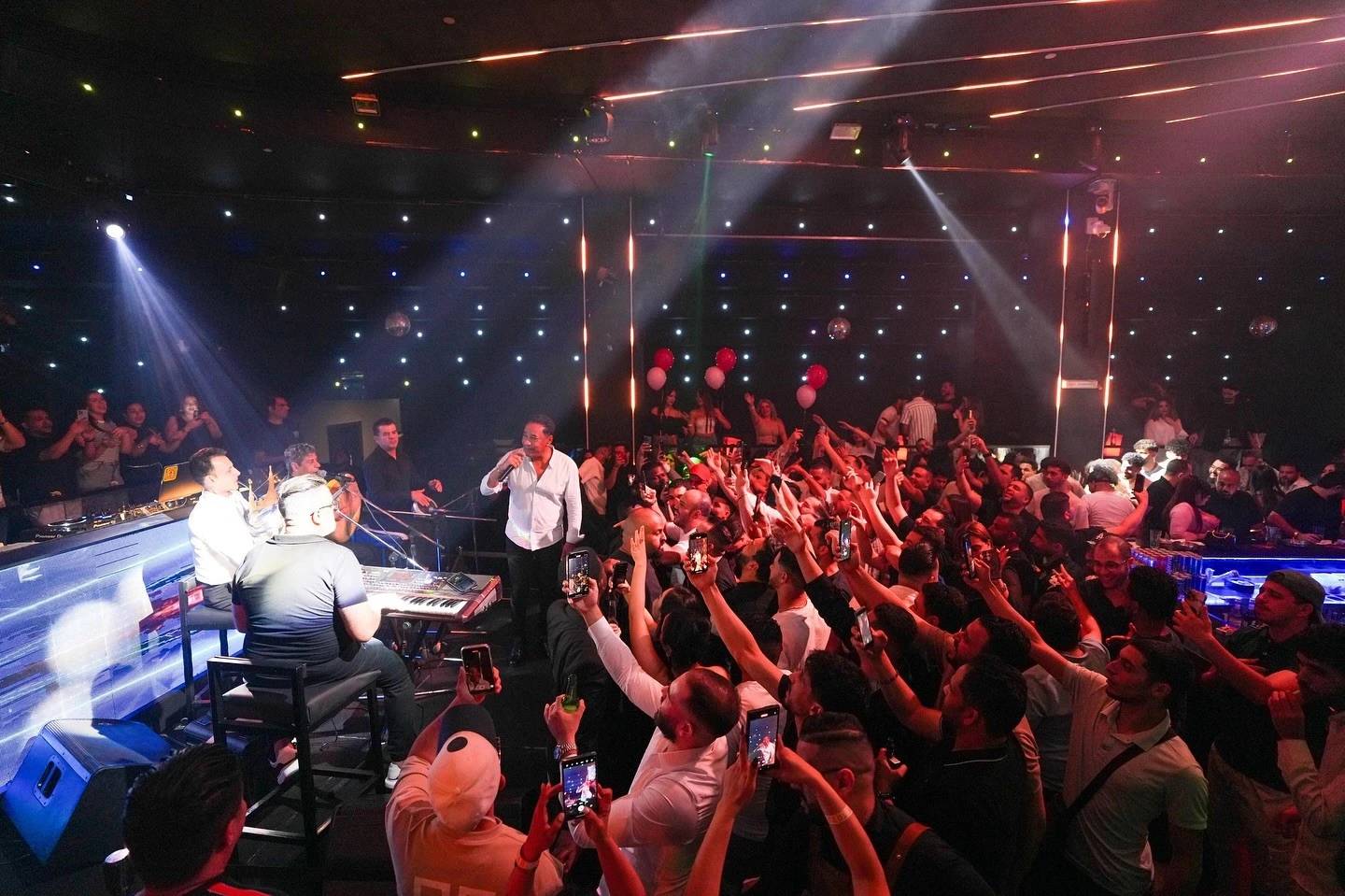 Live performance at OX Club Doha with enthusiastic crowd.