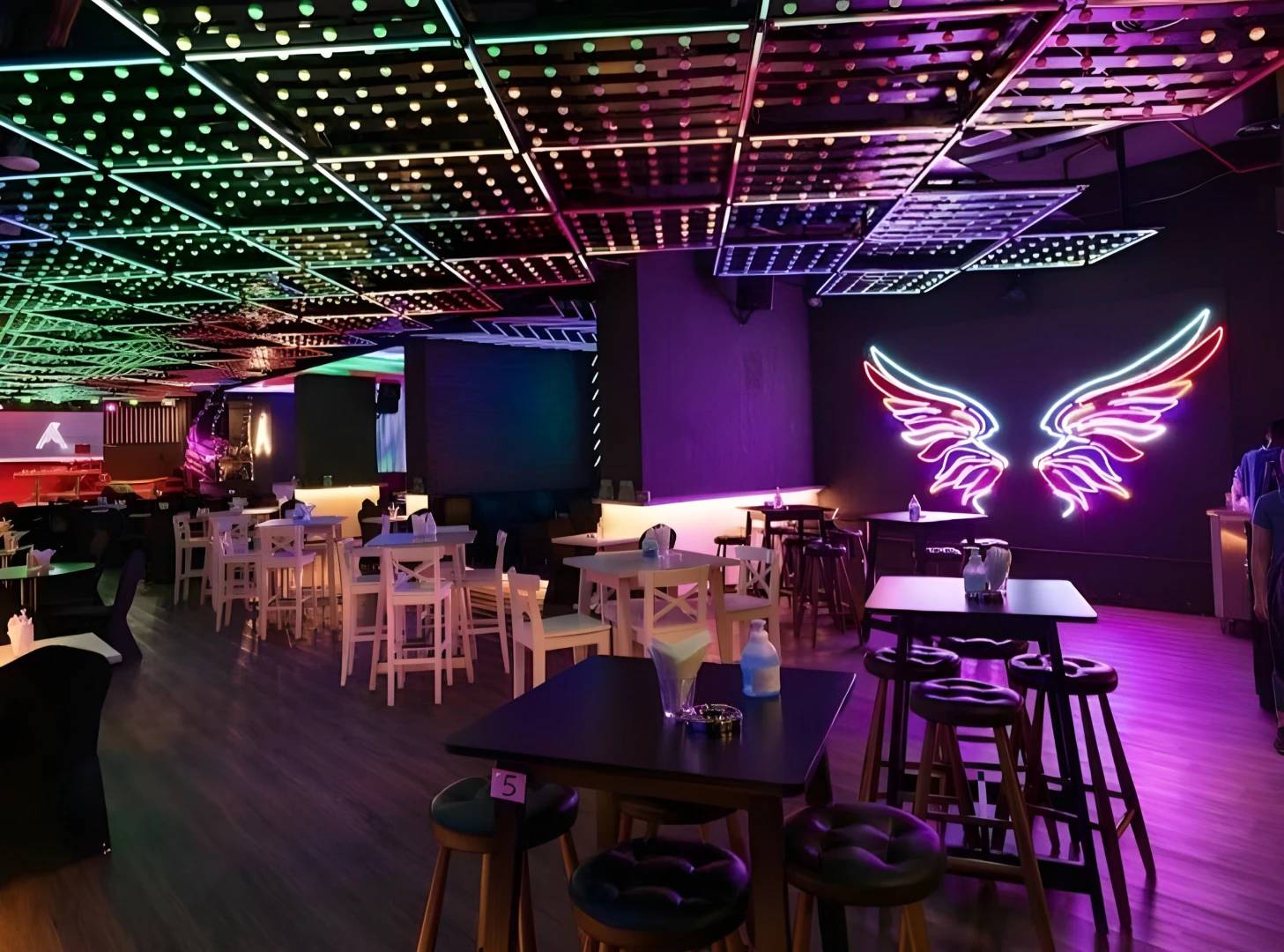 Colorful interior of Matrix Club Qatar in Doha with neon lights.