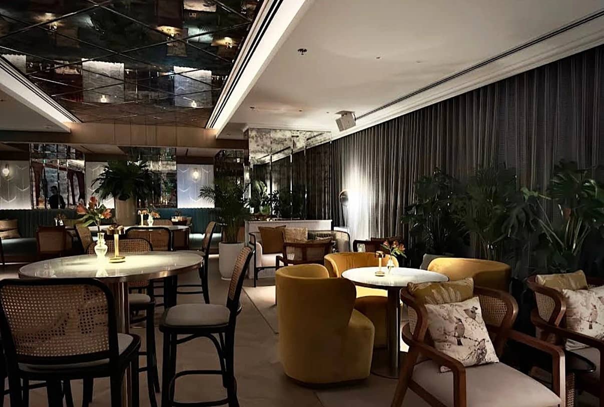 Elegant seating area at Do Tell Bahrain, Manama with plants and decor.