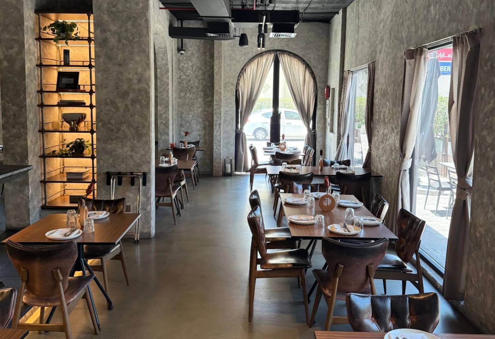 Elegant dining area at 11 Woodfire Restaurant, Dubai.