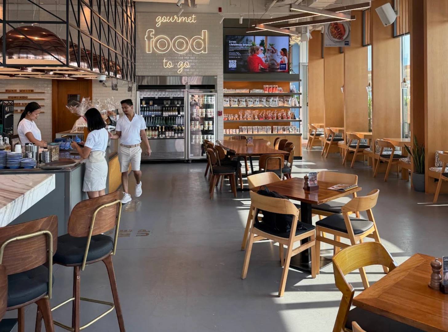 Jones the Grocer interior, modern dining area, Palm Jumeirah, Dubai.