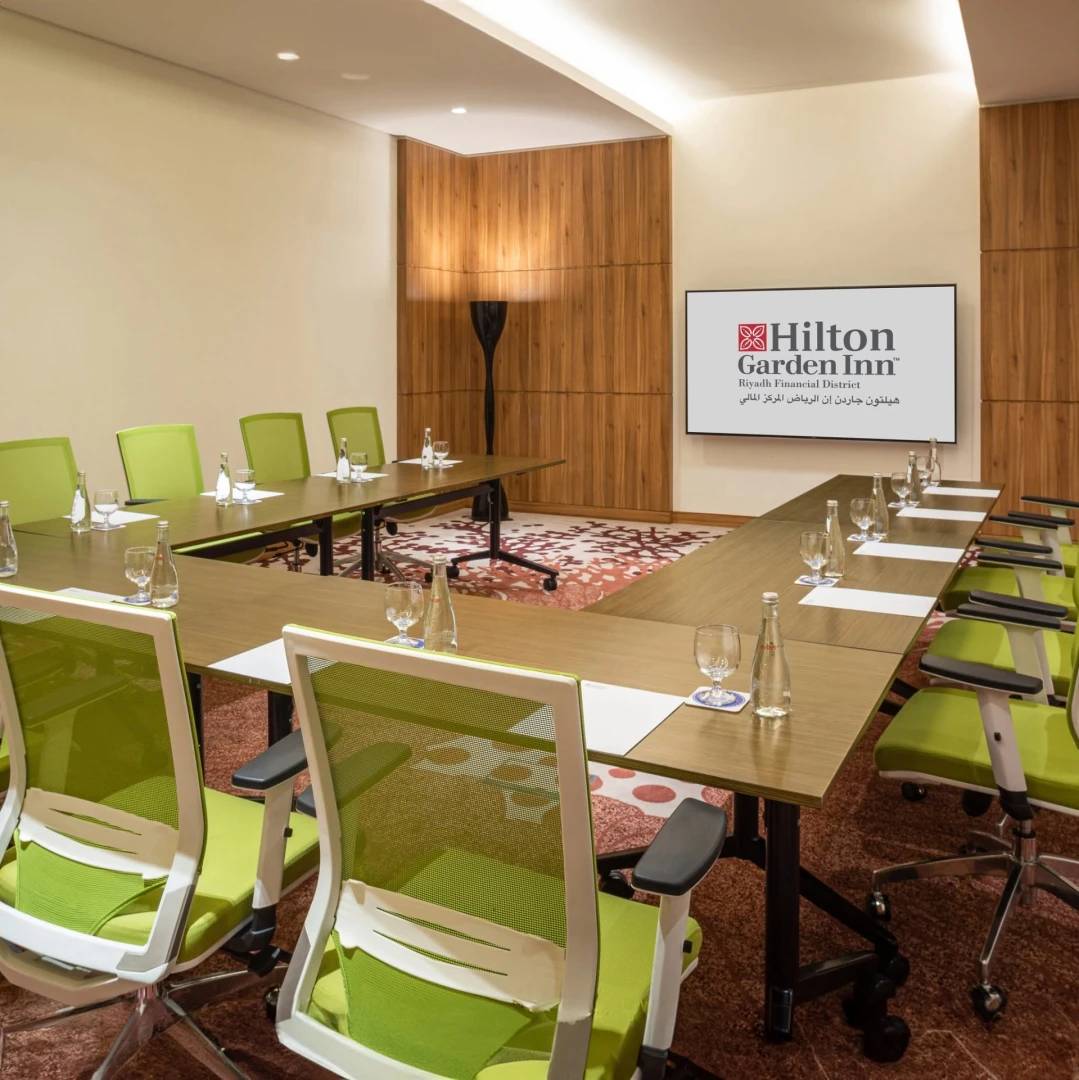 Conference room with green chairs at Hilton Garden Inn Riyadh Financial District, Riyadh.
