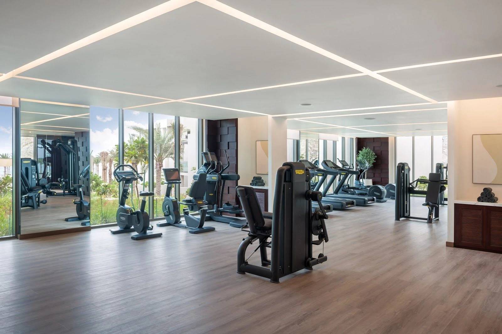 Modern gym with exercise equipment at Address Beach Resort Fujairah, Fujairah, UAE