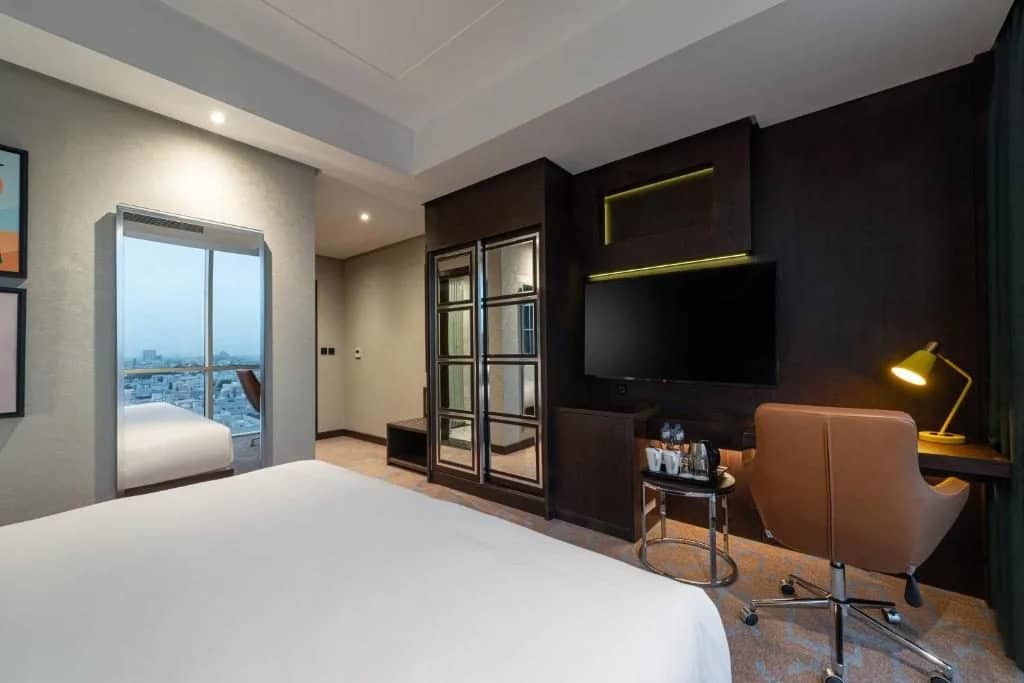 Guest room with desk and TV at Holiday Inn Riyadh al Malaz, Riyadh, Saudi Arabia