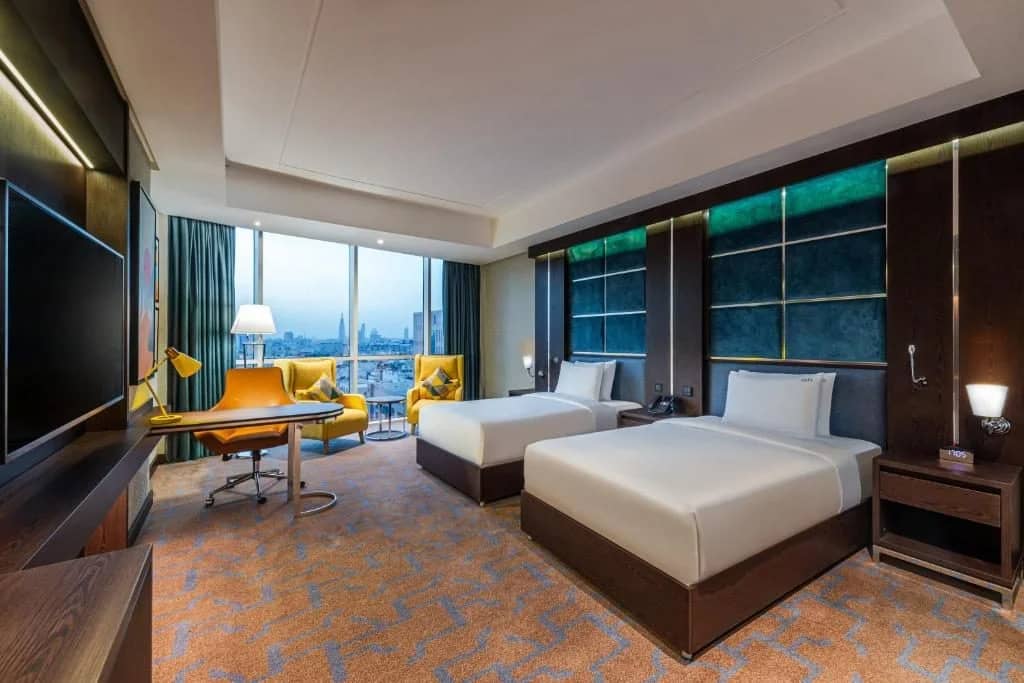 Modern guest room with two beds at Holiday Inn Riyadh al Malaz, Riyadh.