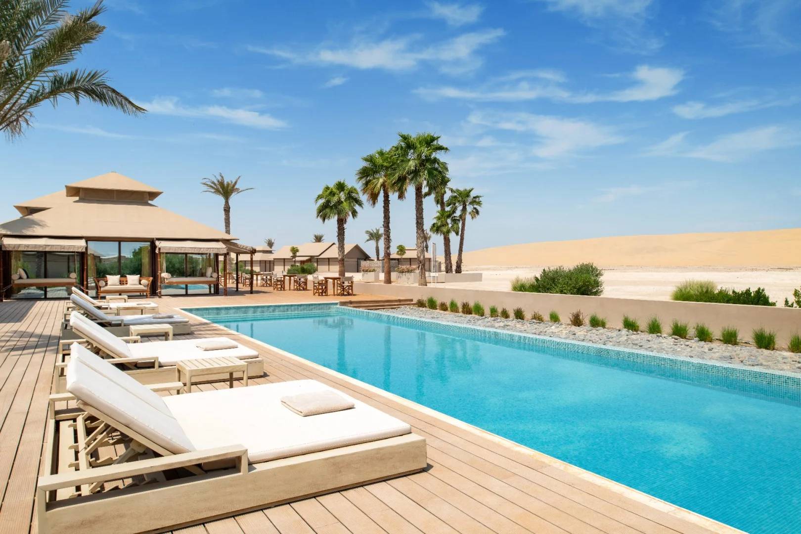 Poolside lounge area at The Outpost Al Barari, Doha, QATAR
