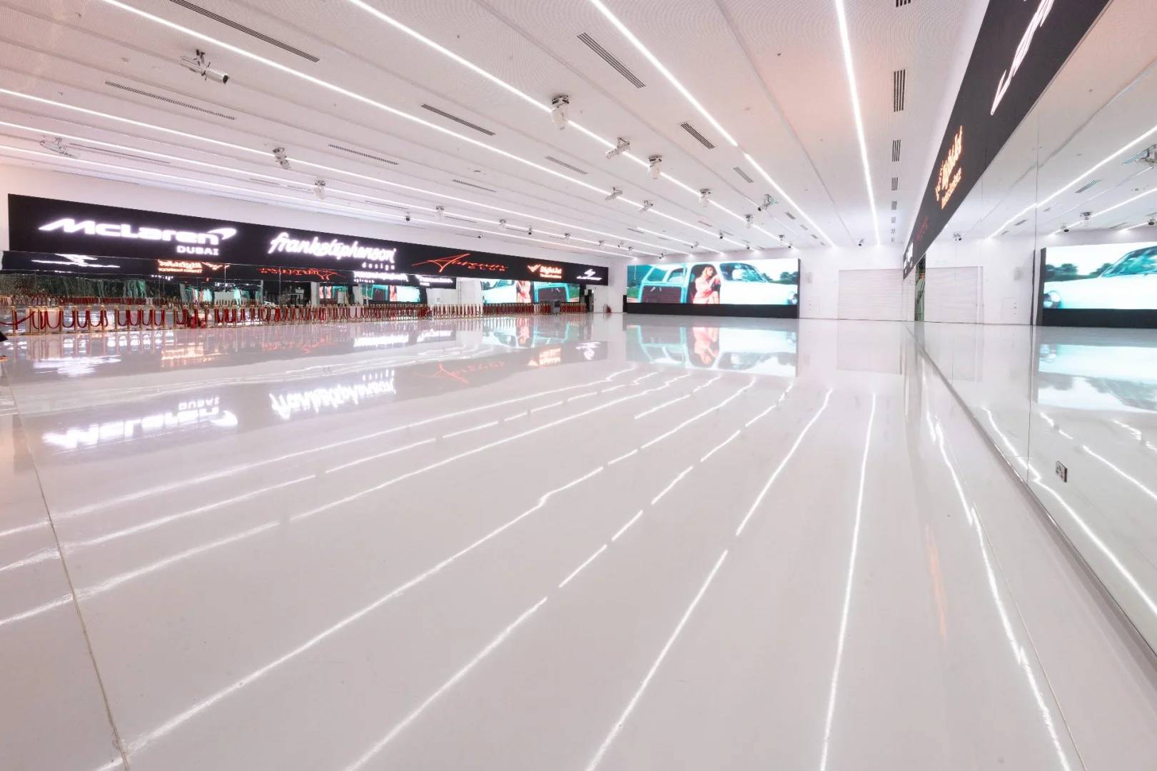 Spacious, modern interior with LED screens at Aureum Club, Dubai, UAE