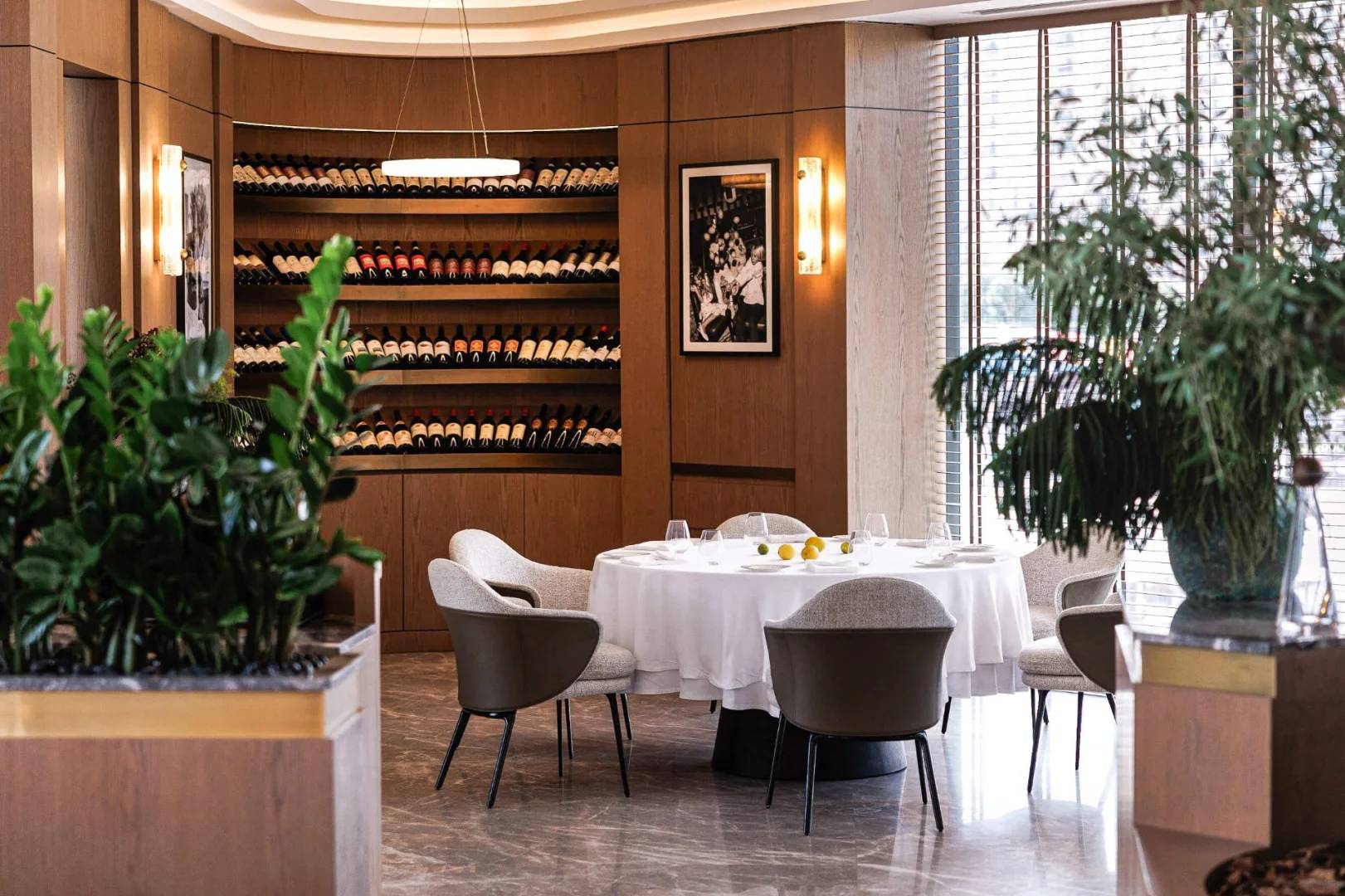 Elegant dining area with wine display at LaFamiglia Dubai, Dubai, UAE