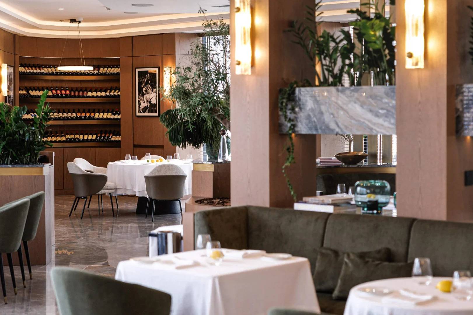 Elegant dining area with wine shelves at LaFamiglia Dubai, Dubai, UAE