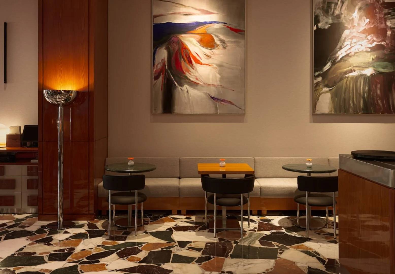 Seating area with abstract paintings at Coffeemania Dubai Hills Mall, Dubai, UAE