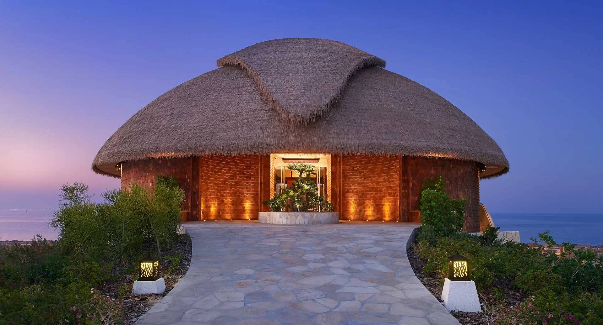 Thatched-roof venue exterior at Banana Island Resort Doha By Anantara, Doha, QATAR