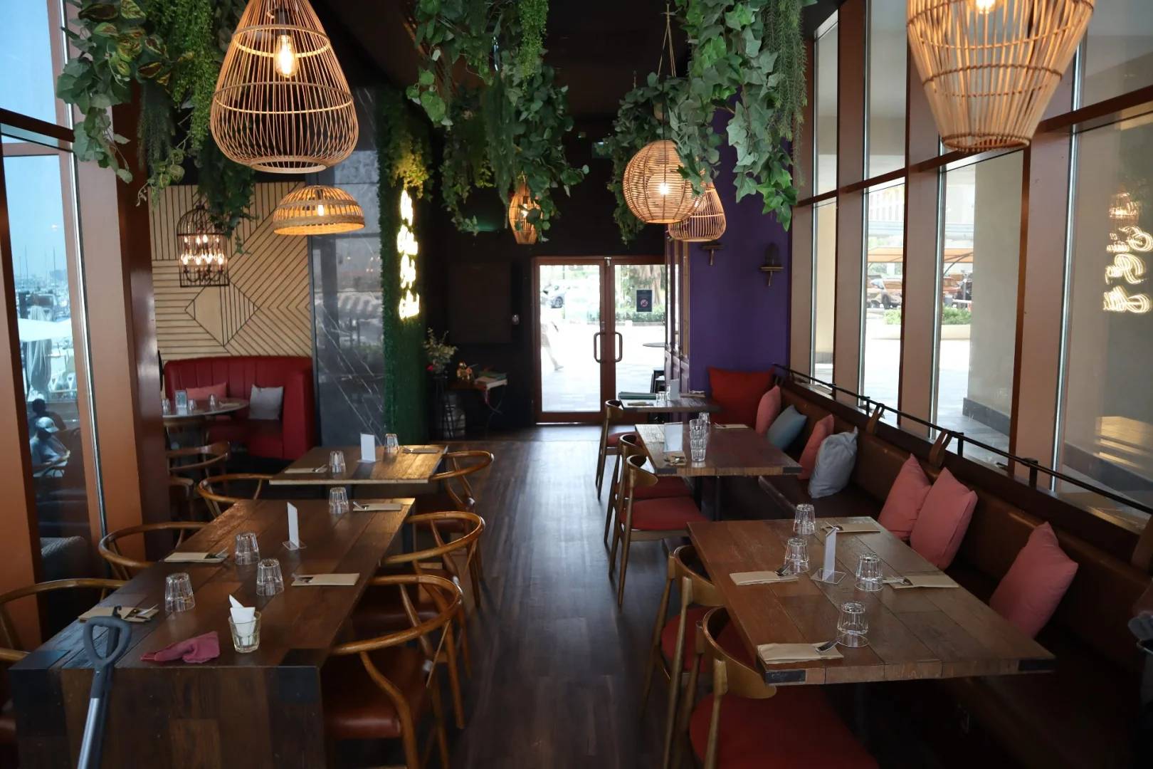 Cozy dining area with wooden tables at Ella's Eatery Restaurant Dubai, UAE.
