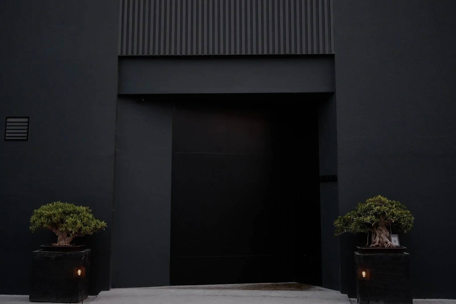 Modern entrance with potted plants at Bocasu Dubai, Dubai, UAE