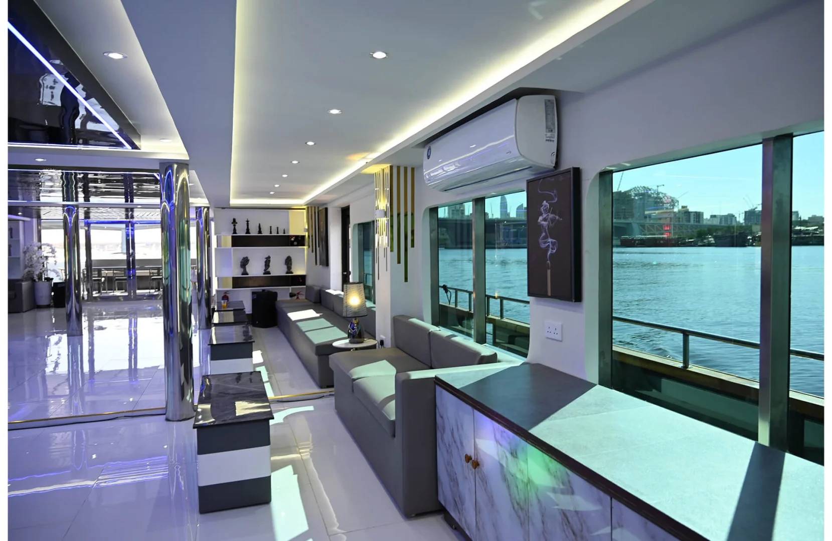 Luxurious interior with waterfront view at Royal Rave Yacht, Dubai, UAE