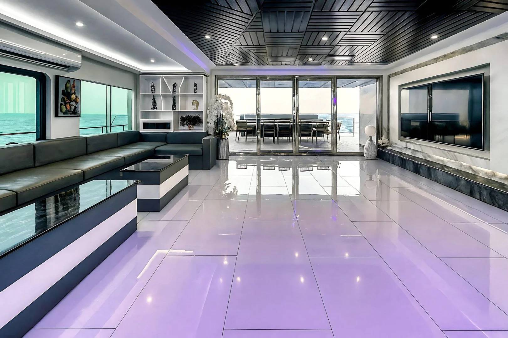 Luxurious interior with seating and ocean view at Royal Rave Yacht, Dubai, UAE
