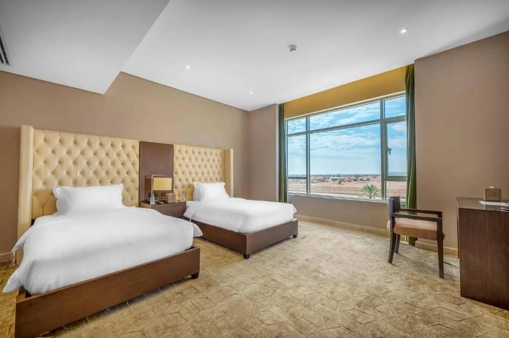 Guest room with two beds at Sukani Royal Hotel Hail, Hail, Saudi Arabia