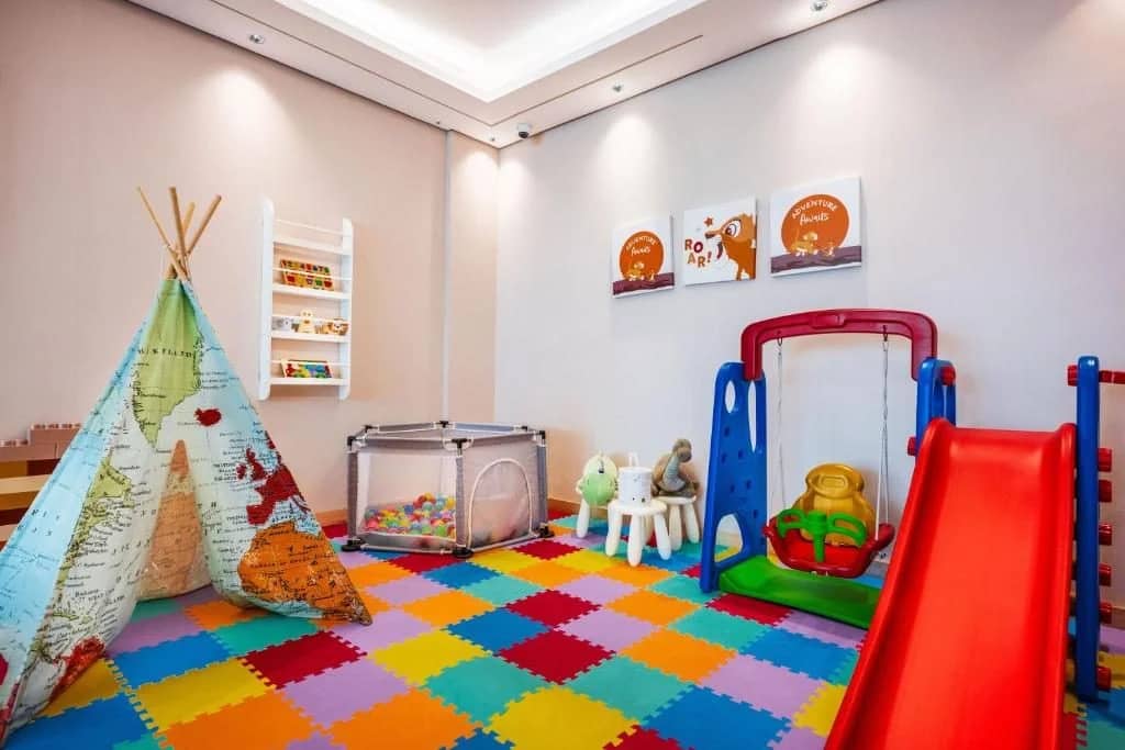 Colorful children's play area with slide and toys at Ayas Hotel Hail, Saudi Arabia.