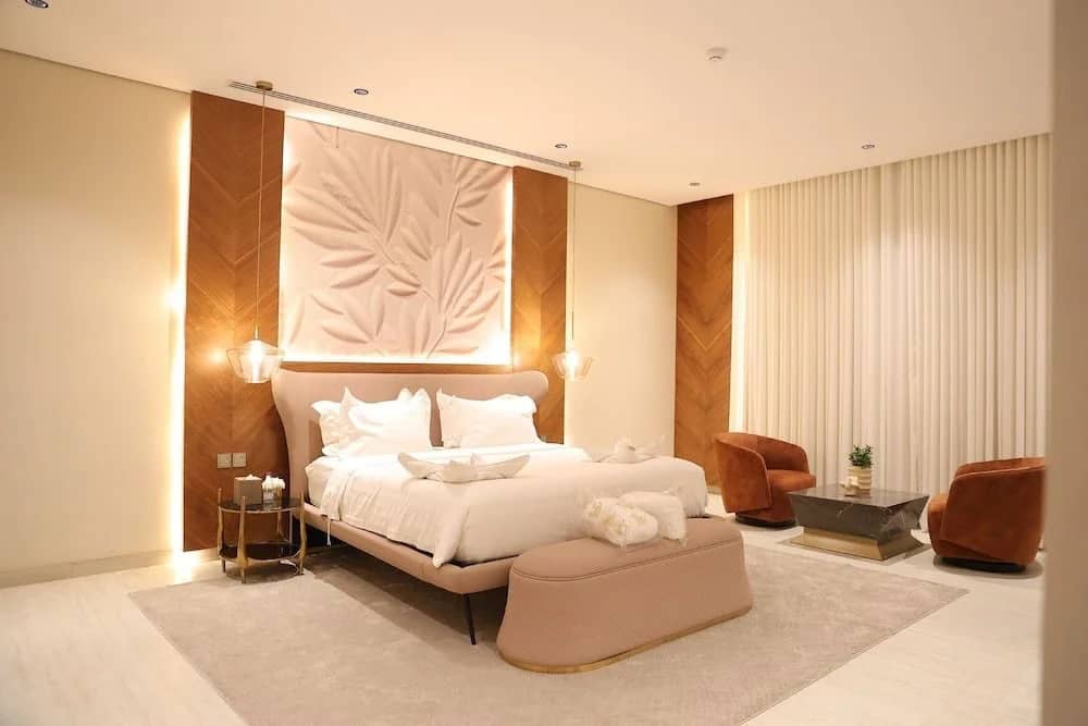 Luxurious guest room with modern decor at Suknai Resort Riyadh, Saudi Arabia.