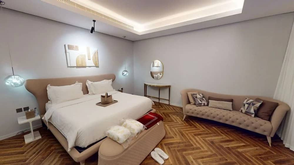 Elegant guest room with modern decor at Suknai Resort Riyadh, Saudi Arabia.