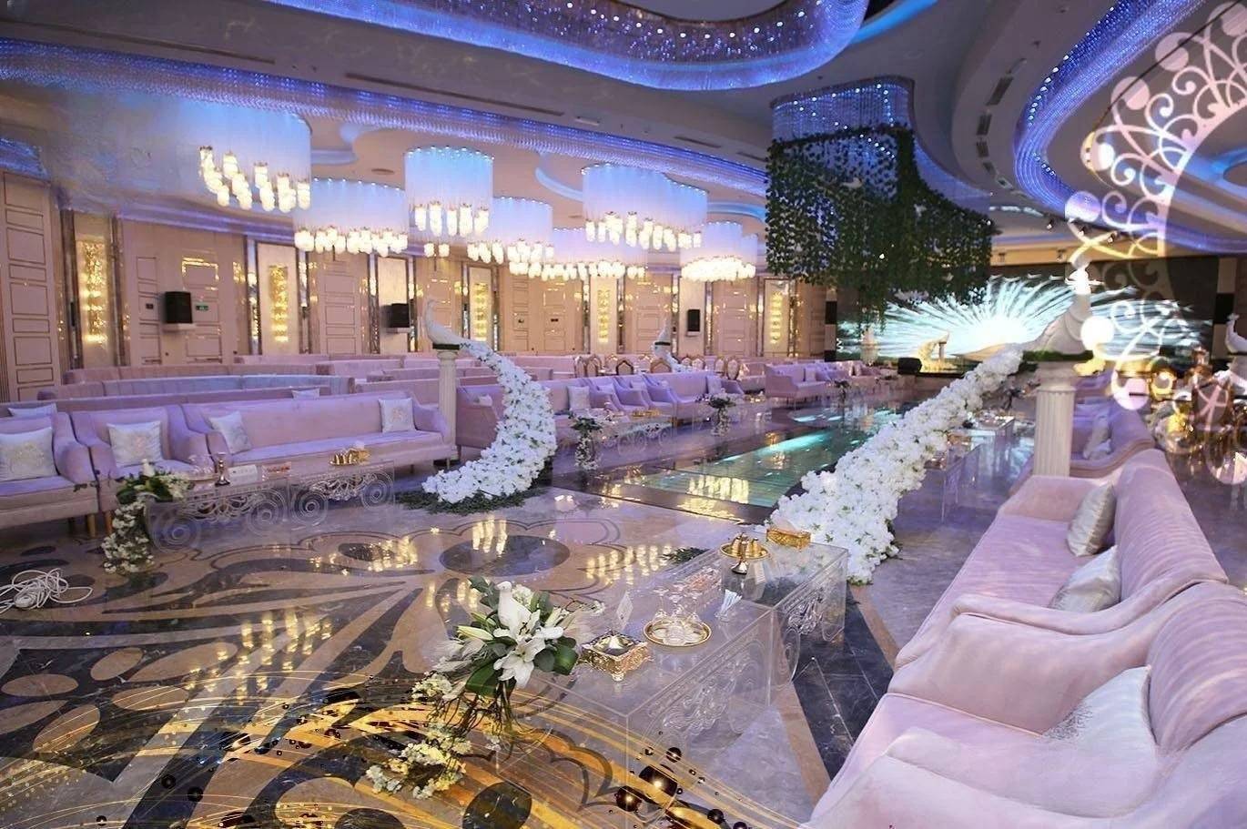 Elegant interior with chandeliers and floral decor at H Laylati Event Venue, Madinah.