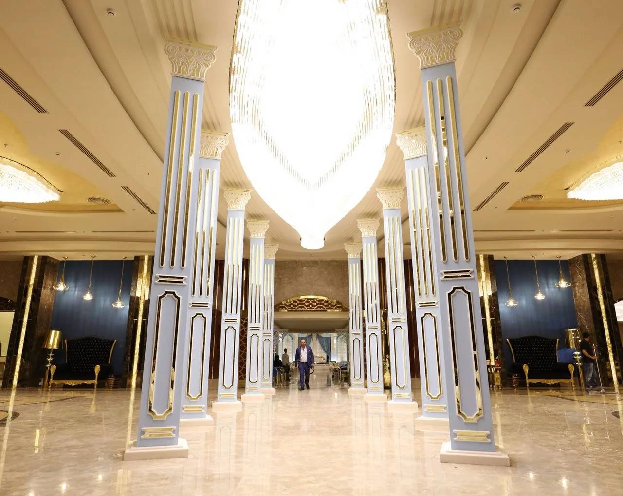 Elegant interior with columns and chandeliers at H Laylati Event Venue, Madinah.