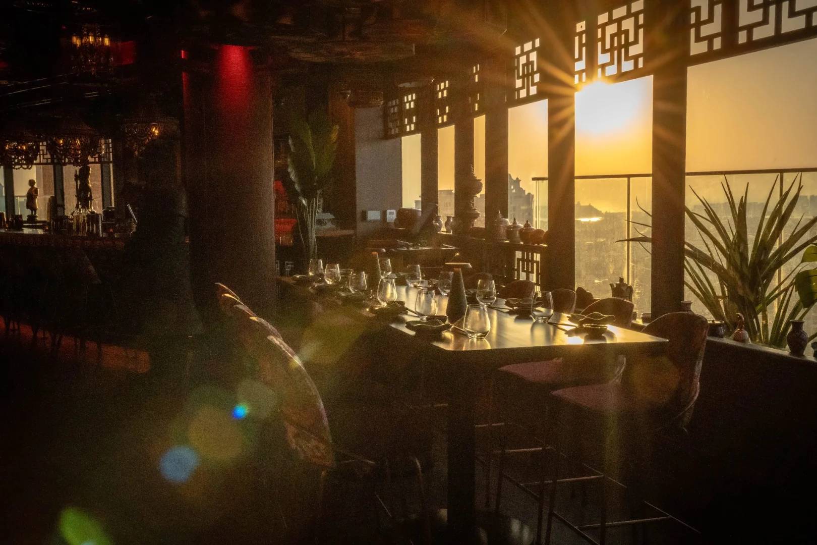 Sunlit dining area with elegant decor at Asia Asia The Palm, Dubai, UAE