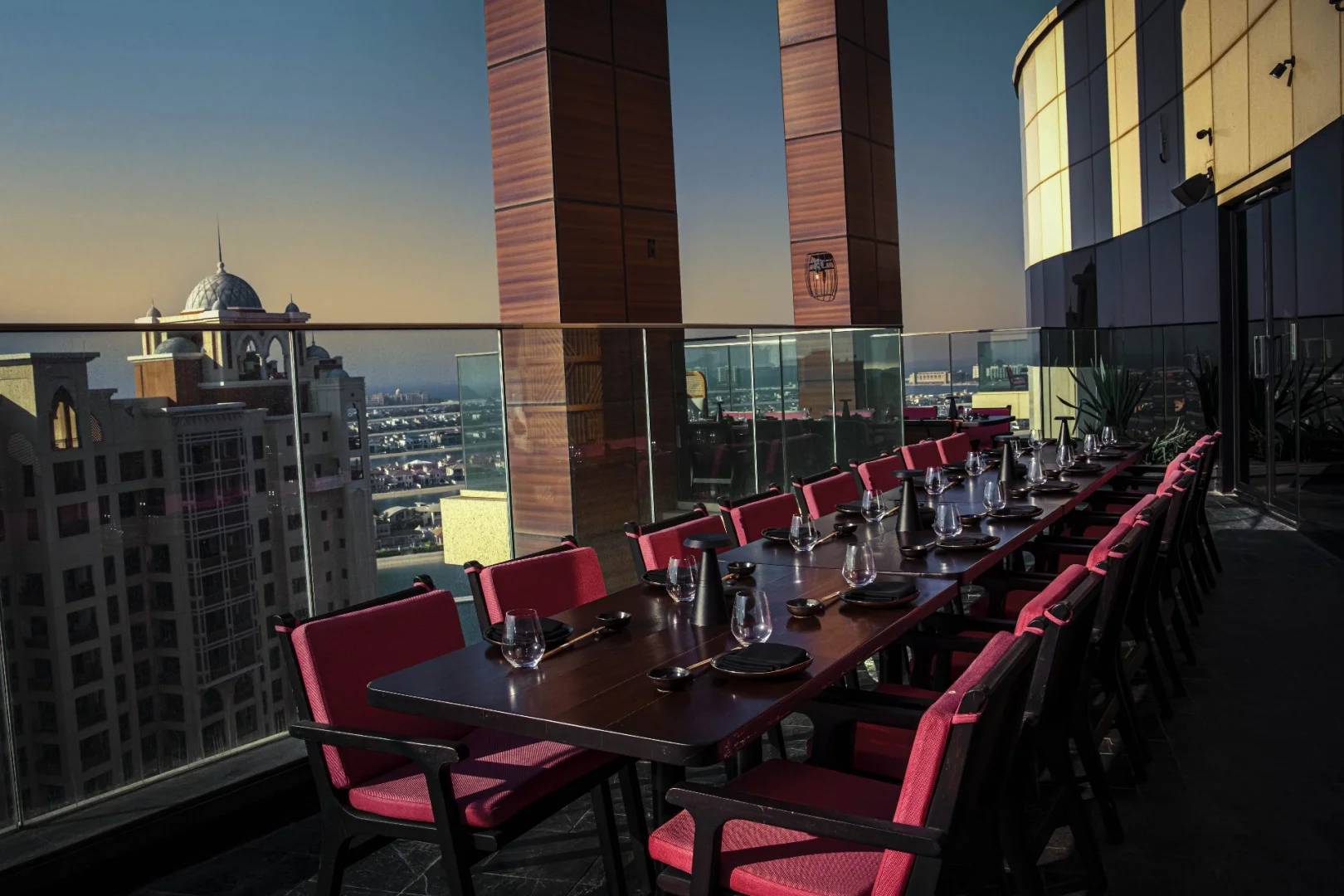 Outdoor dining setup with city view at Asia Asia The Palm, Dubai, UAE
