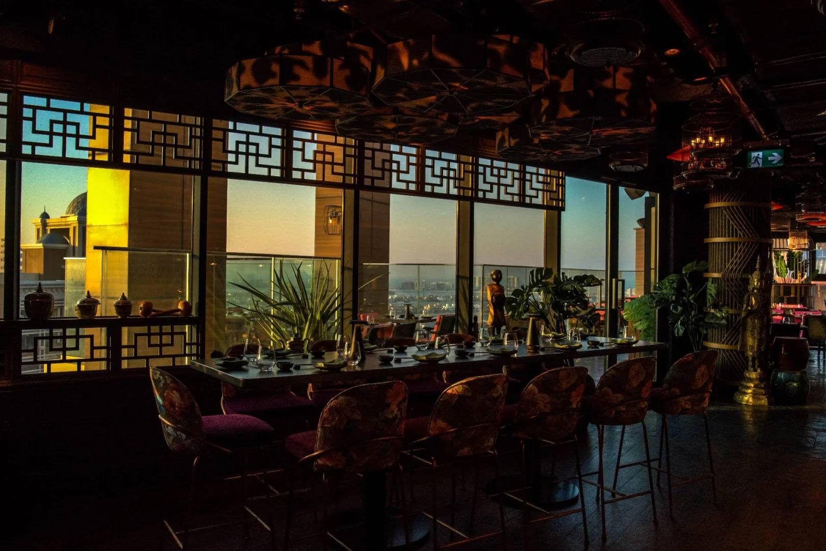 Elegant dining area with city view at Asia Asia The Palm, Dubai, UAE.