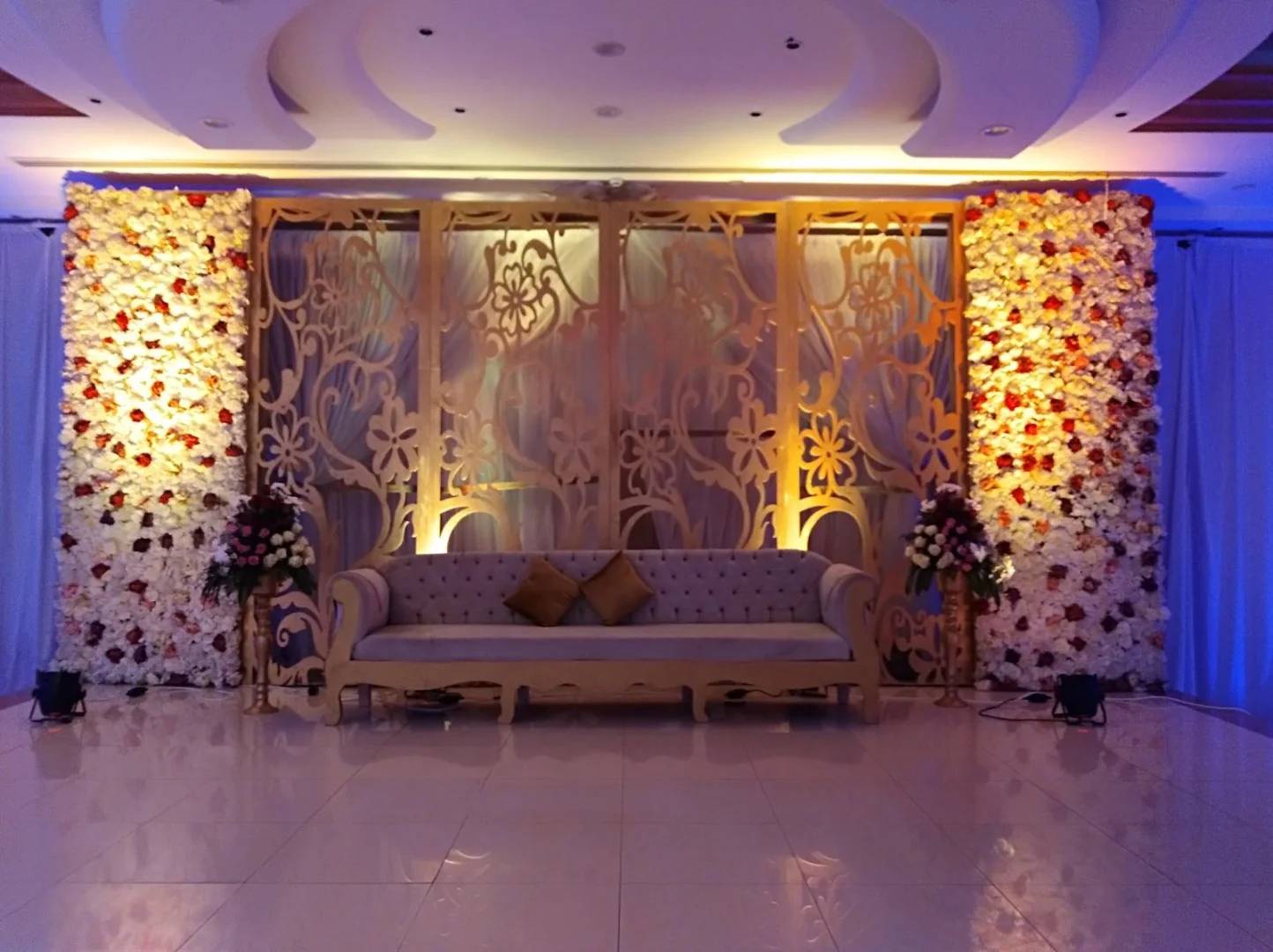 Elegant floral backdrop and sofa at Sadeem Celebrations Hall Abha, Saudi Arabia