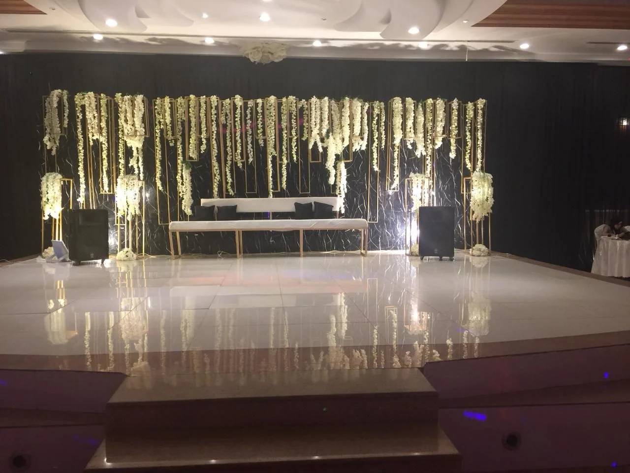 Elegant stage with floral decorations at Sadeem Celebrations Hall Abha, Saudi Arabia.