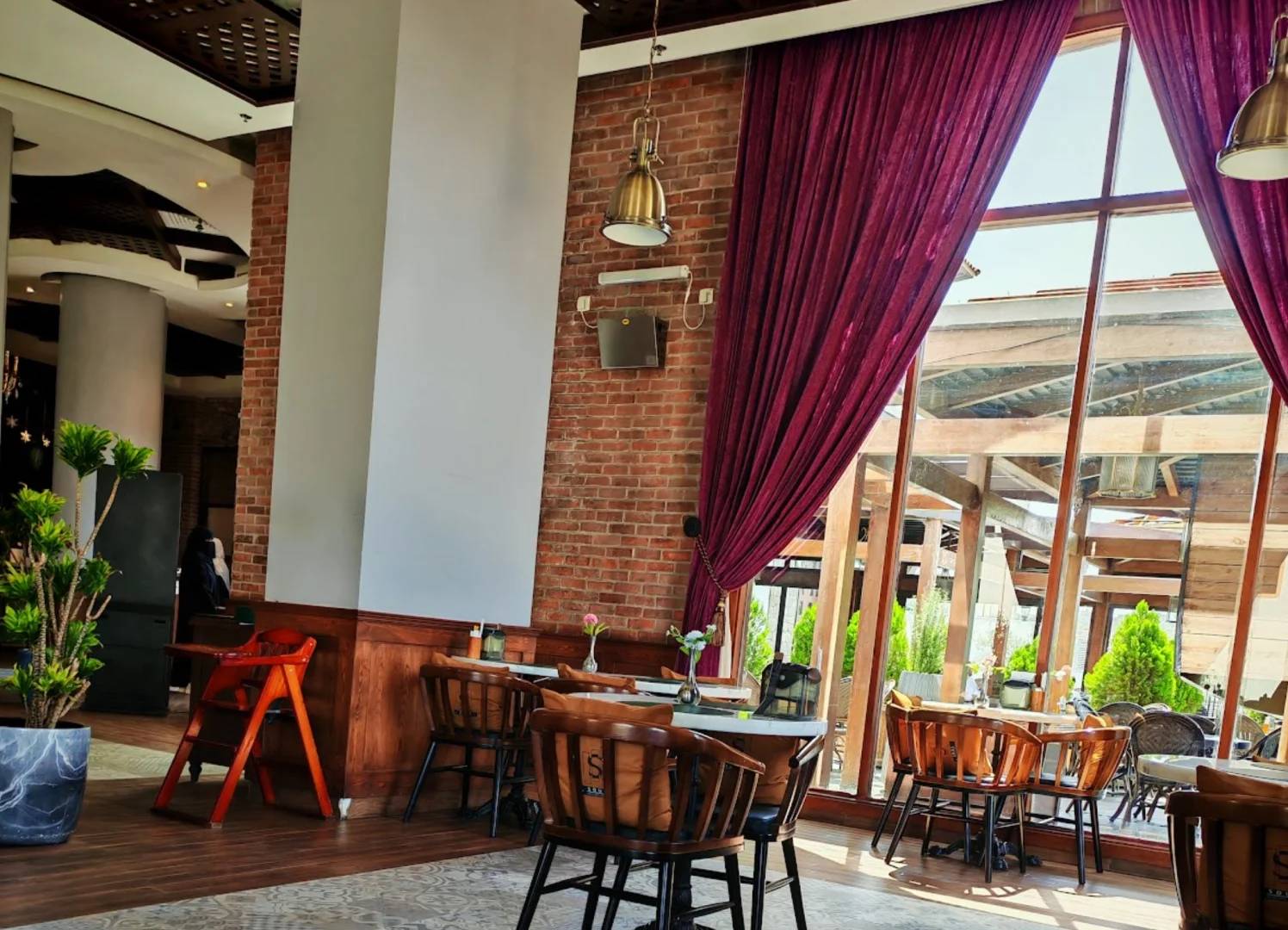 Elegant dining area with large windows at Soul Restaurant Al Bahah, Al Bahah, Saudi Arabia.