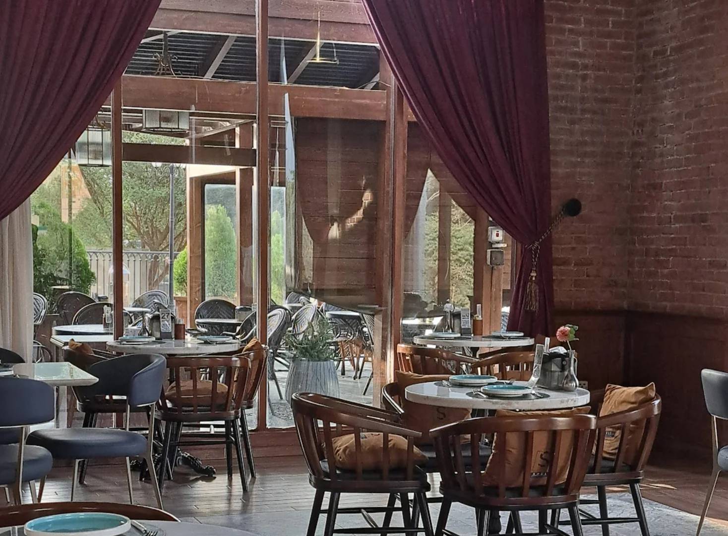 Elegant dining area with wooden chairs at Soul Restaurant Al Bahah, Al Bahah, Saudi Arabia.