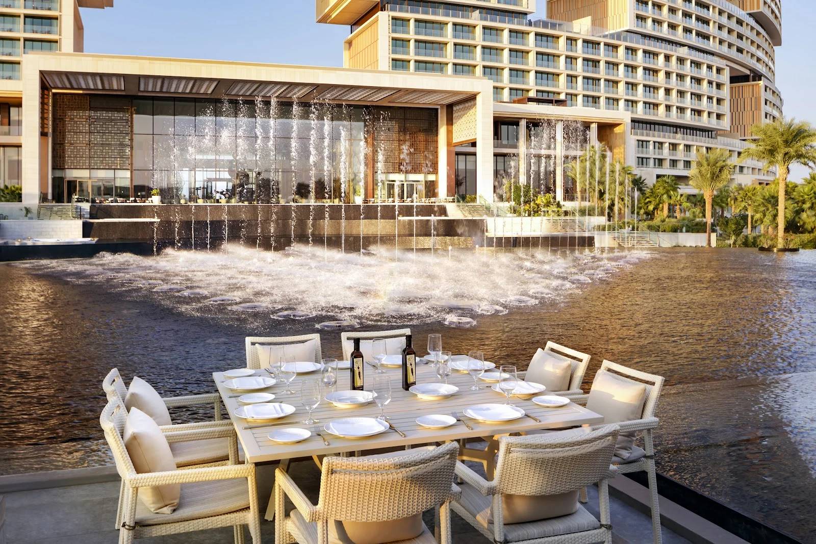 Outdoor dining setup overlooking fountains at Estiatorio Milos Dubai, UAE