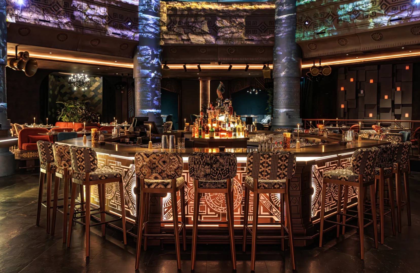Elegant bar area with patterned stools at AMARU Dubai, Dubai, UAE