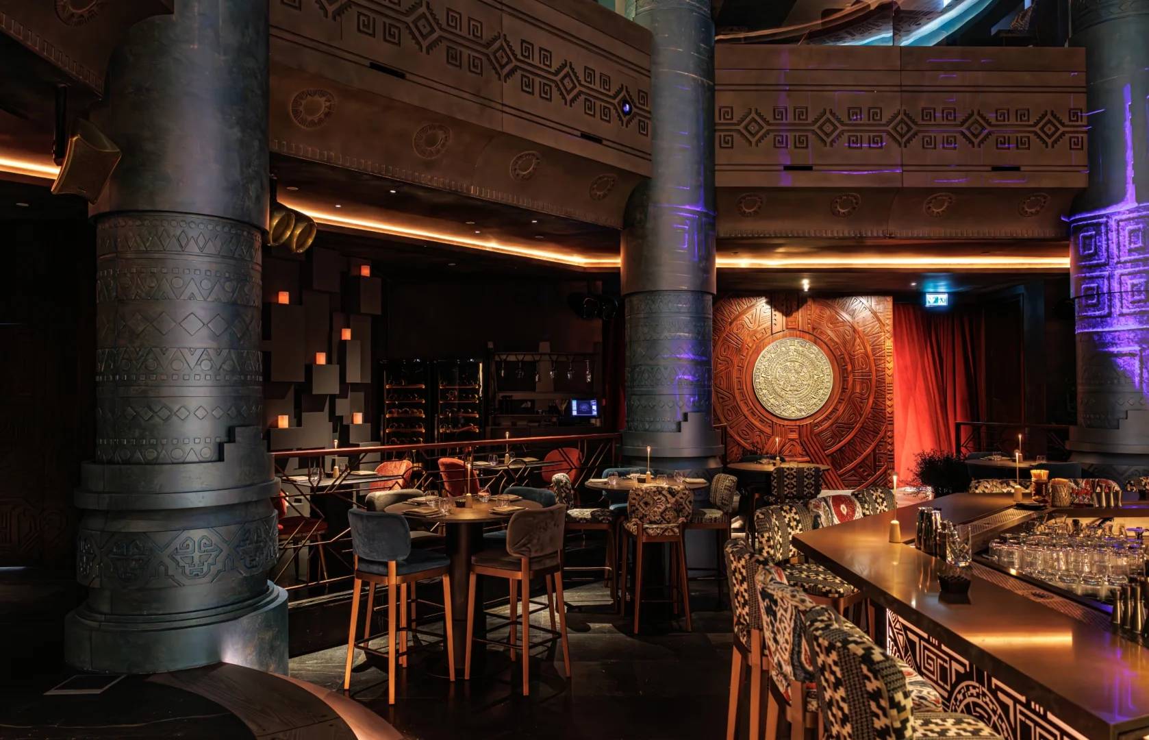 Elegant interior with ornate columns and seating at AMARU Dubai, Dubai, UAE