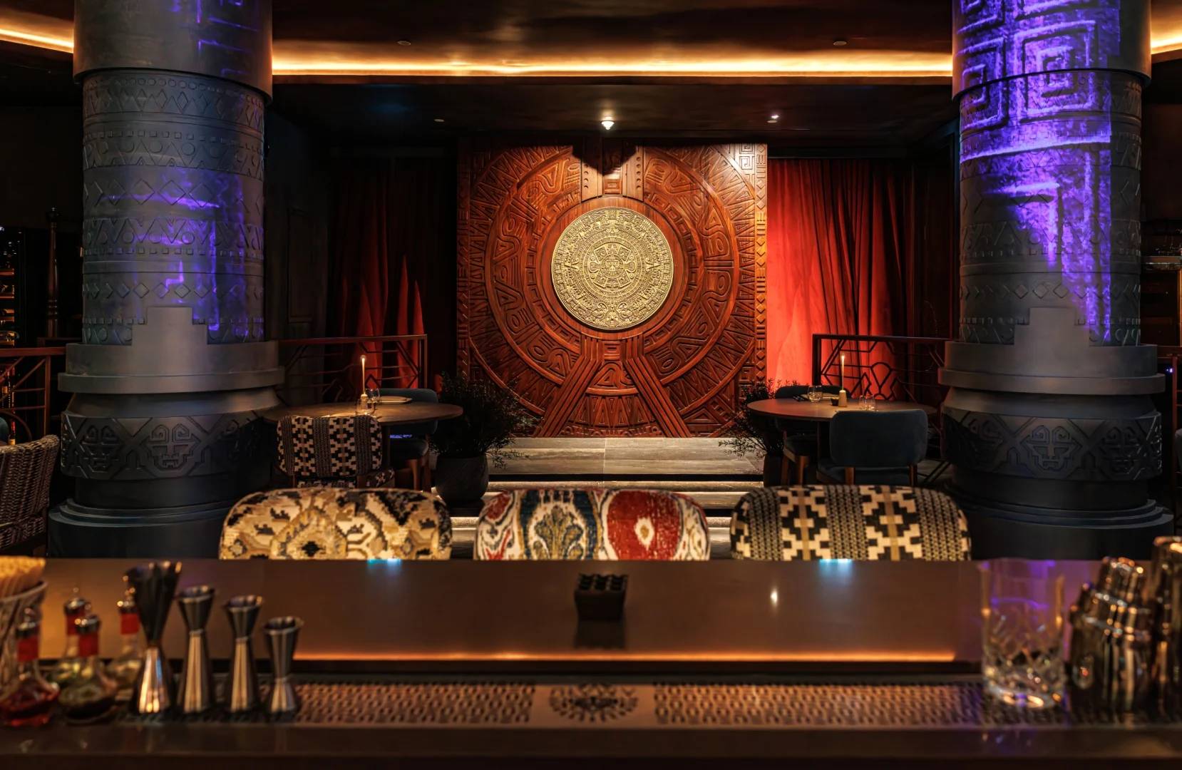 Elegant interior with ornate columns and bar at AMARU Dubai, Dubai, UAE