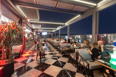 Grand Washington Hotel - people sitting at tables in a restaurant with a view at Grand Washington Hotel in Istanbul