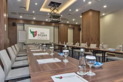 Hotel Boursier 1 & Spa - a conference room with a long table and chairs at Hotel Boursier 1 &amp; Spa in Istanbul