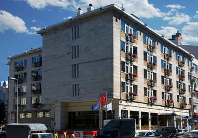 Hotel Buyuk Keban - a large building with cars parked in front of it at Hotel Buyuk Keban in Istanbul