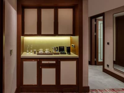 Mövenpick Hotel Istanbul Asia Airport - a room with a kitchen with a counter and a door at Mövenpick Hotel Istanbul Asia Airport in Istanbul