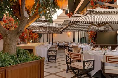 Elegant outdoor dining at Lion in the Sun Dubai venue.