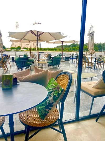 BRNCH Restaurant & Cafe outdoor seating with umbrellas, Dubai.