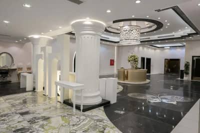 Elegant interior with columns and chandelier at One Thousand and One Nights Wedding Hall Madinah, Saudi Arabia