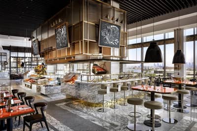 Luxurious dining area at Atlantis The Royal, Dubai with city views.