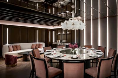 Elegant dining room at Atlantis The Royal, Dubai with round table.