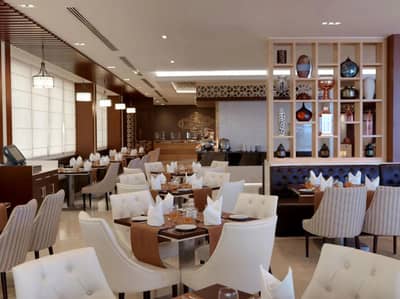 Elegant dining area at Two Seasons Hotel, Dubai with modern decor.